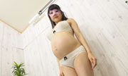 The lower part of the pregnant woman body. Manaka 1